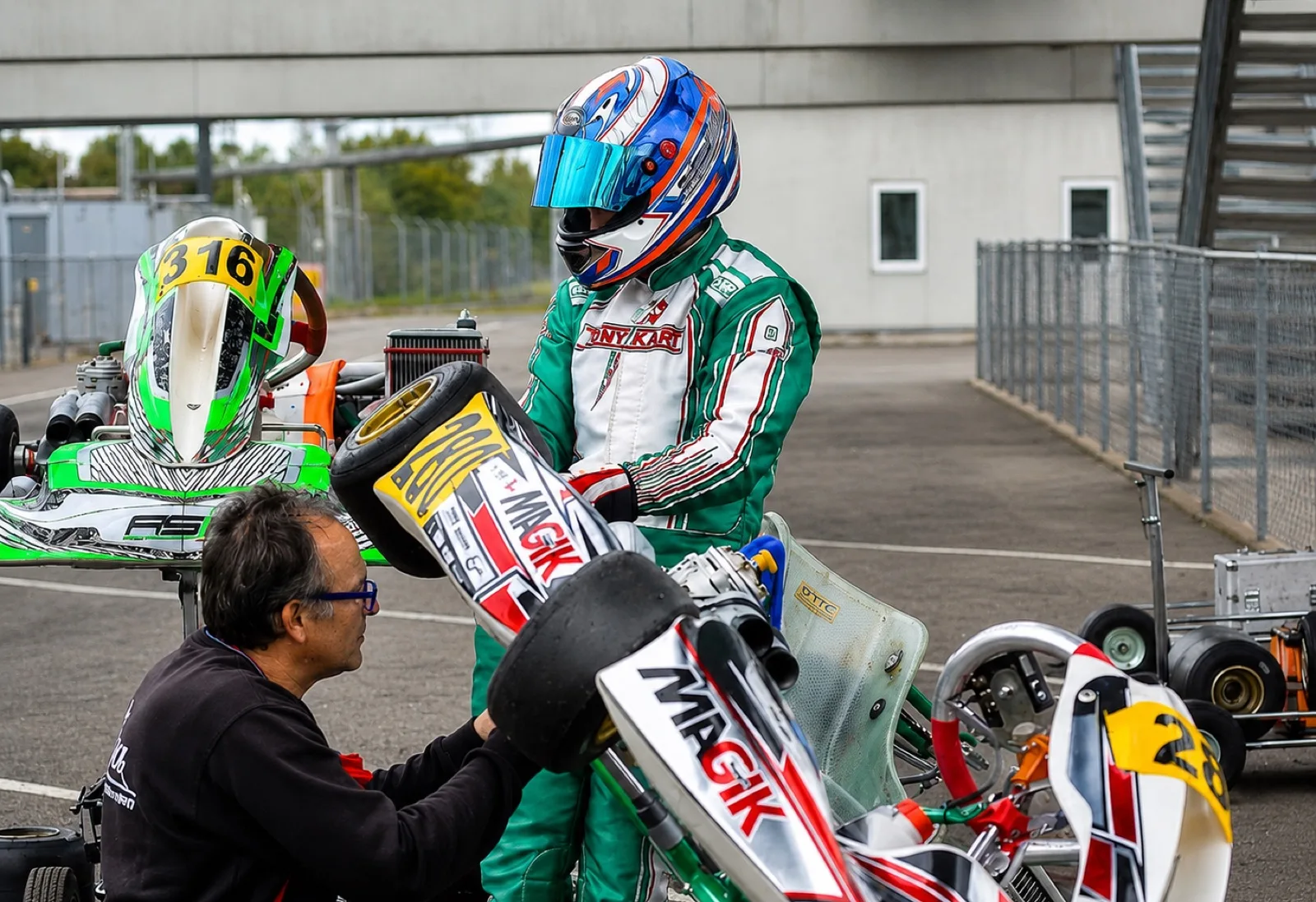 Nico in karting gear next to his shifter kart at Kristianstad before the crash